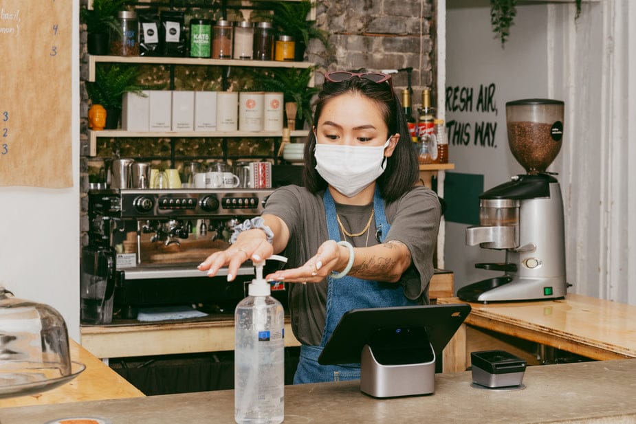 Coffee shop barista sanitising their hands, Health and Safety Responsibilities of Employers | Be-Safe