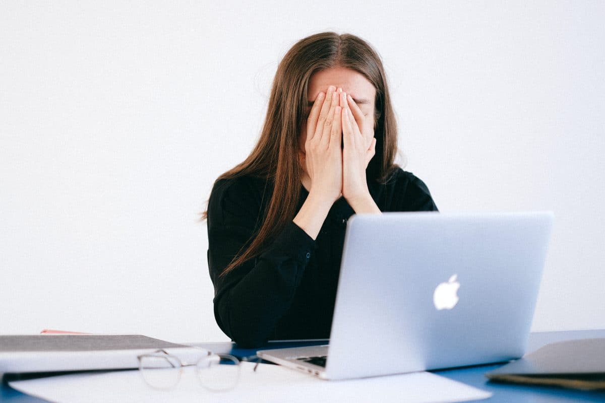 A tired employee in front of her laptop, Display Screen Equipment - Is Your Computer Making You Ill?
