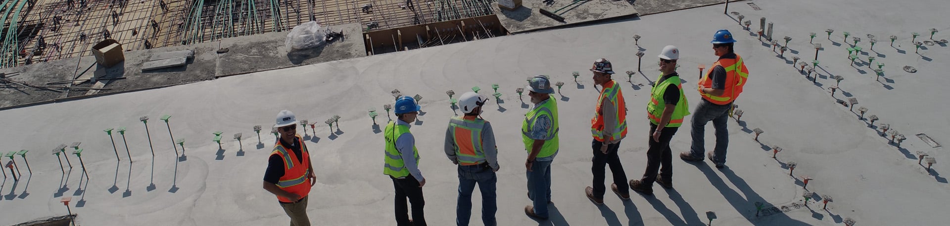 Workers surveying a construction project, h&s software | Be-Safe
